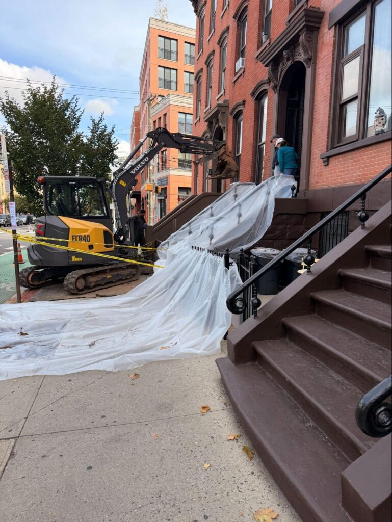 Grove Street, Jersey City: protected work area on the busy street