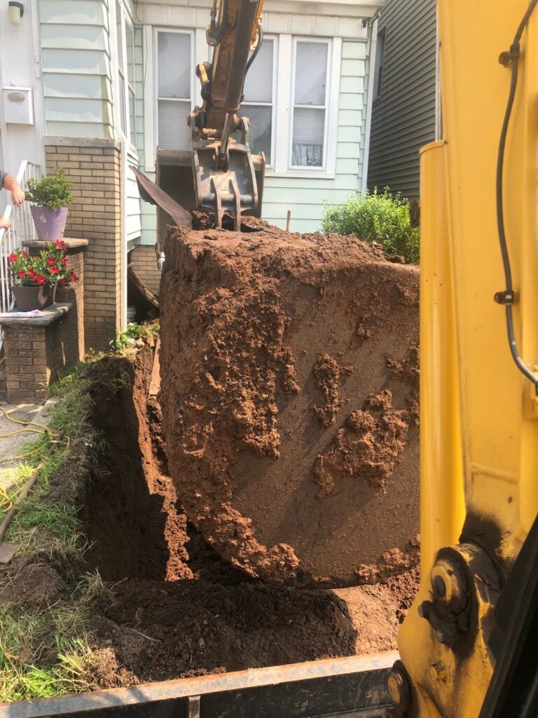 Wegman Parkway, Jersey City: lifting the 1,000-gallon tank out of the front yard